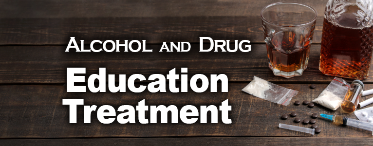 Glasses of alcohol and drugs on a wooden table. Caption reads Alcohol and Drug Education Treatment