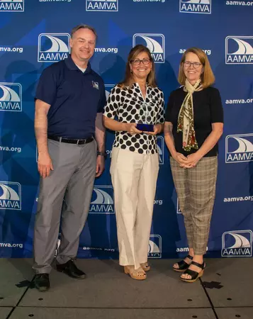 Colorado Division of Motor Vehicles Senior Director Electra Bustle, center, accepts one of five awards from the American Association of Motor Vehicle </body></html>