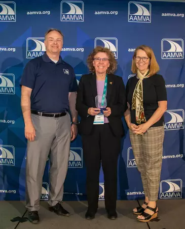 Colorado Division of Motor VehiclesDriver License Director Lori Daigle, center, accepts one of five awards from the American Association of Motor Vehicle Administrators on Wednesday, May 3, in Phoenix, Arizona. The DMV received awards for customer service, communications and its website. Pictured with Daigle are Anne Ferro, President and CEO of AAMVA, and Eric Jorgensen, Arizona Motor Vehicle Division Administrator. (AAMVA Photo)