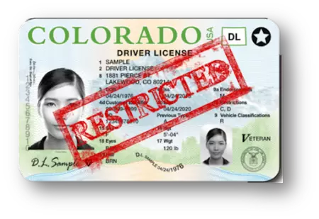 Colorado driver license with red stamped text reading restricted across the front of license