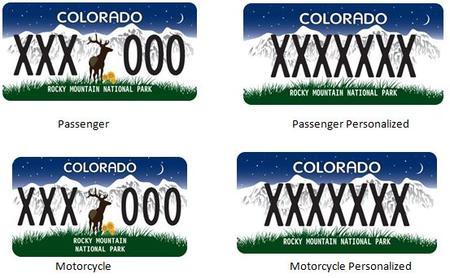 Rocky Mountain National Park Colorado License Plate featuring a blue nighttime background with white mountains and a deer in the middle