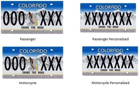 Share the Road Colorado License Plate with a blue gradient background and white mountains with a person riding a bike on the road